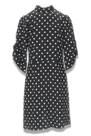 Bella sort og hvit polkadot kjole